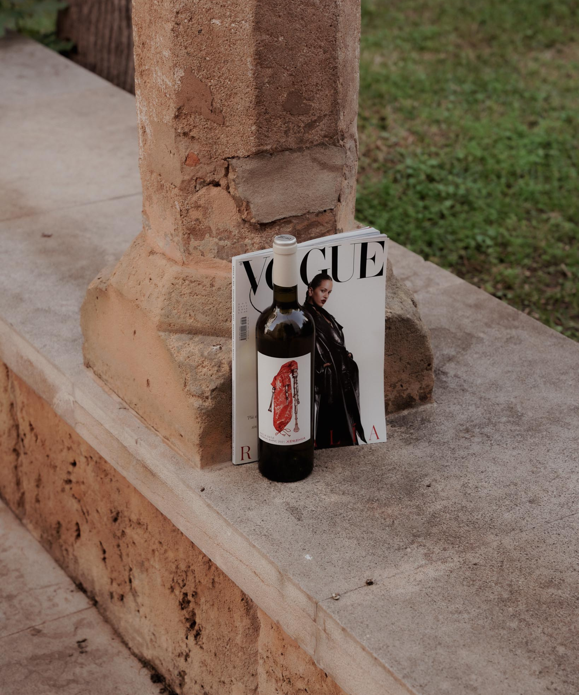 bottle of white wine against a Vogue magazine