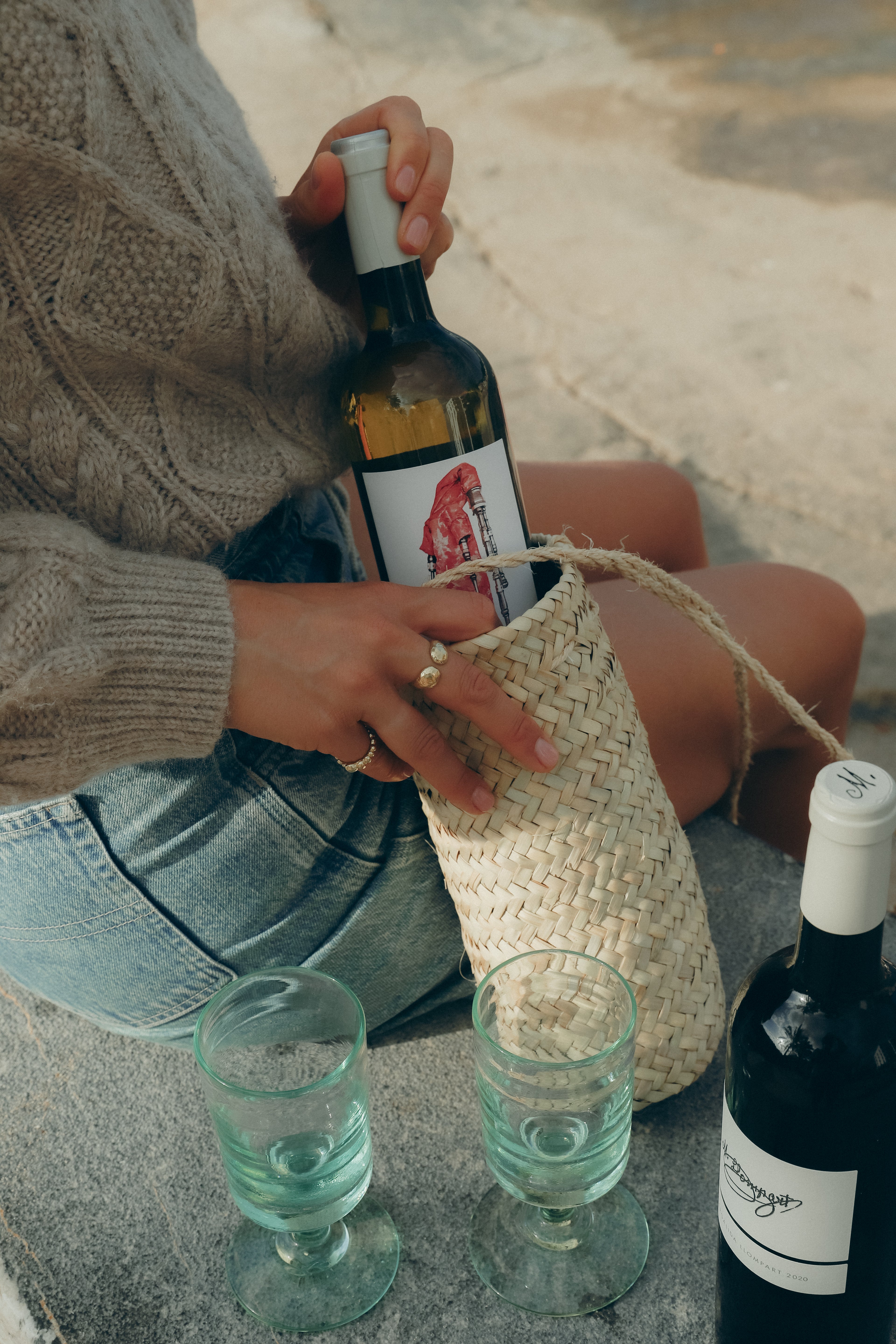 bottle in a winebag on the beach